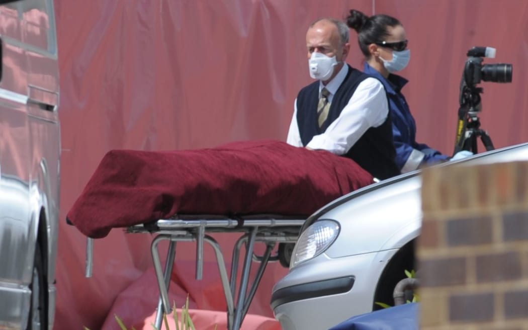 The body is removed from the Endeavor Hills Police Station.