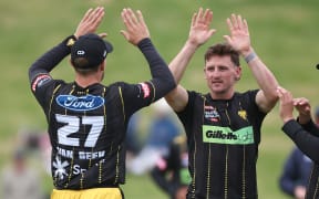 Firebirds' Nathan Smith (R celebrates Brave’s Henry Cooper being caught with LBW with team mate Logan Van Beek (L) during the Dream11 Super Smash - Wellington  Firebirds v Northern Brave at Cello Basin Reserve,   Wellington. 15 January 2024. © Copyright image by Marty Melville / www.photosport.nz