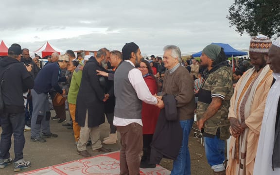 A Muslim leader greets lawyer Moana Jackson at a powhiri at Ihumātao.