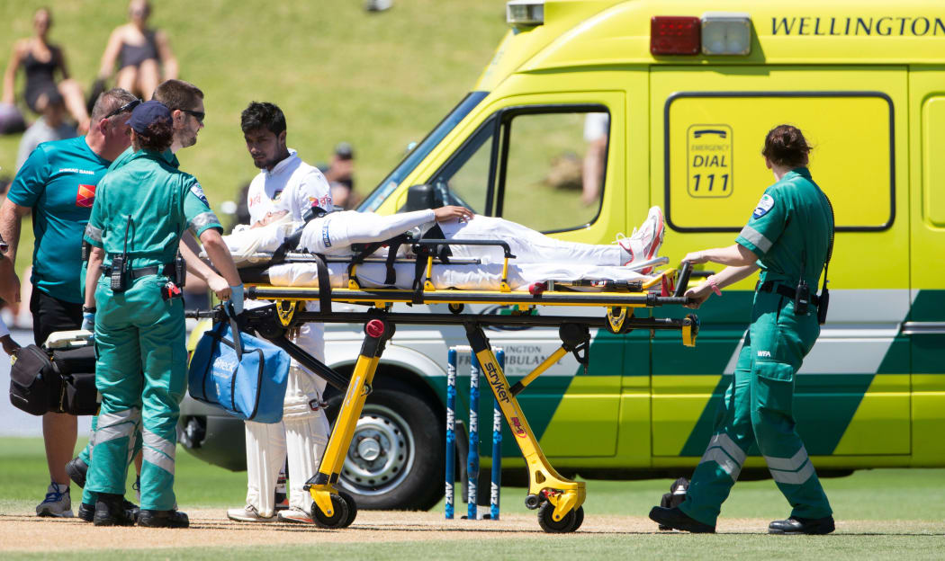 Bangladeshi batsman Mushfiqur Rahim being stretchered off after being felled by a Tim Southee bouncer at the Basin Reserve.