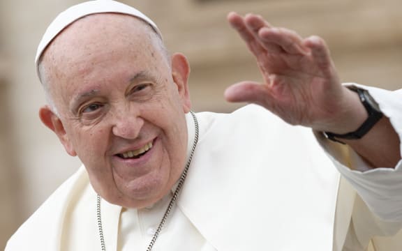 Pope Francis smile and greets when he leaves at the end of his weekly general audience in Saint Peter's square in The Vatican on November 15, 2023 (Photo by Massimo Valicchia/NurPhoto) (Photo by Massimo Valicchia / NurPhoto / NurPhoto via AFP)
