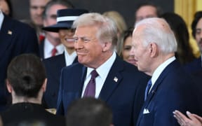 US President Joe Biden looks on as President-elect Donald Trump arrives for the inauguration ceremony before Trump is sworn in as the 47th US President in the US Capitol Rotunda in Washington, DC, on January 20, 2025.