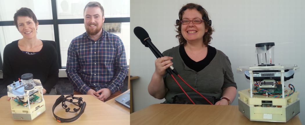 Denise Taylor and Nathan Scott with the mind-controlled robot and headset, and Ruth Beran wearing the headset after controlling the robot