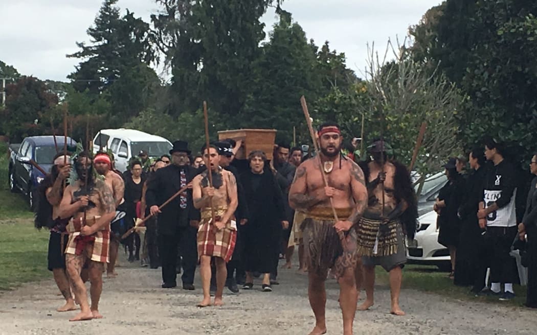 The body of Awanuiārangi Black is escorted onto his marae near Tauranga.