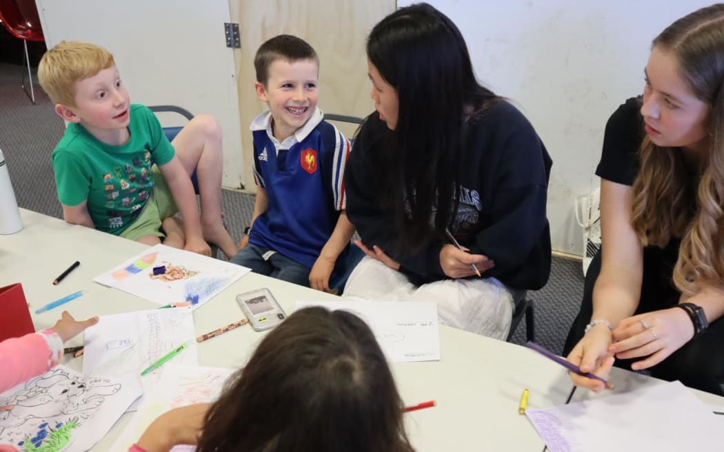 Hien Tran with some of her eager science learners
