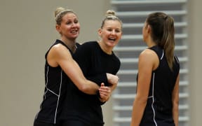 Silver Ferns captain Casey Kopua (L) hugs fellow New Zealand defender Katrina Grant