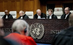 President of the International Court of Justice (ICJ) US lawyer Joan Donoghue (2R) confers with colleagues at the court in The Hague on January 12, 2024, prior to the hearing of the genocide case against Israel, brought by South Africa. Israel said that it was not seeking to destroy the Palestinian people, as it hit back at what it called a "profoundly distorted" and "malevolent" genocide case against it at the UN's top court.  South Africa has launched an emergency case at the International Court of Justice (ICJ) arguing that Israel stands in breach of the UN Genocide Convention, signed in 1948 in the wake of the Holocaust. (Photo by Remko de Waal / ANP / AFP) / Netherlands OUT