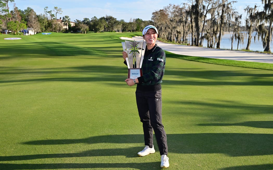 Lydia Ko of New Zealand poses with the trophy after winning the Hilton Grand Vacations Tournament of Champions in Florida, 2024.