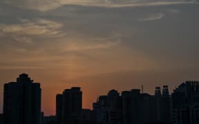 View of residential units during a Covid-19 coronavirus lockdown in the Jing'an district of Shanghai on May 2, 2022. (Photo by Hector RETAMAL / AFP)