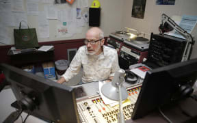 Lloyd in the studio for his final all-night broadcast.