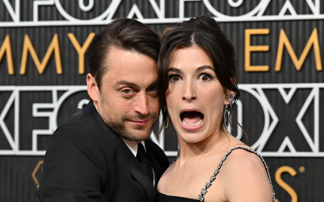 US actor Kieran Culkin and his wife Jazz Charton arrive for the 75th Emmy Awards at the Peacock Theatre at L.A. Live in Los Angeles on January 15, 2024. (Photo by Robyn BECK / AFP)