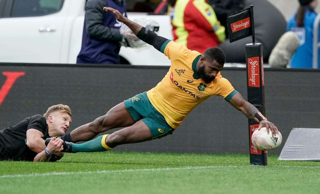 Marika Koroibete goes in to score for the Wallabies.