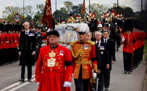 The Procession following the coffin of Queen Elizabeth II, aboard the State Hearse, arrives at The Long Walk in Windsor on September 19, 2022, to make its final journey to Windsor Castle after the State Funeral Service of Britain's Queen Elizabeth II.