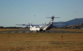 An Air New Zealand turboprop plane prepares for takeoff from Nelson Airport.