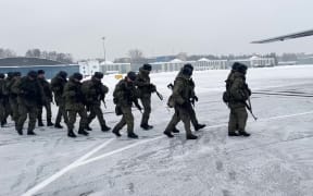 Russian servicemen boarding a military aircraft on their way to Kazakhstan, at an airfield outside Moscow, Russia, on 06 January, 2022.