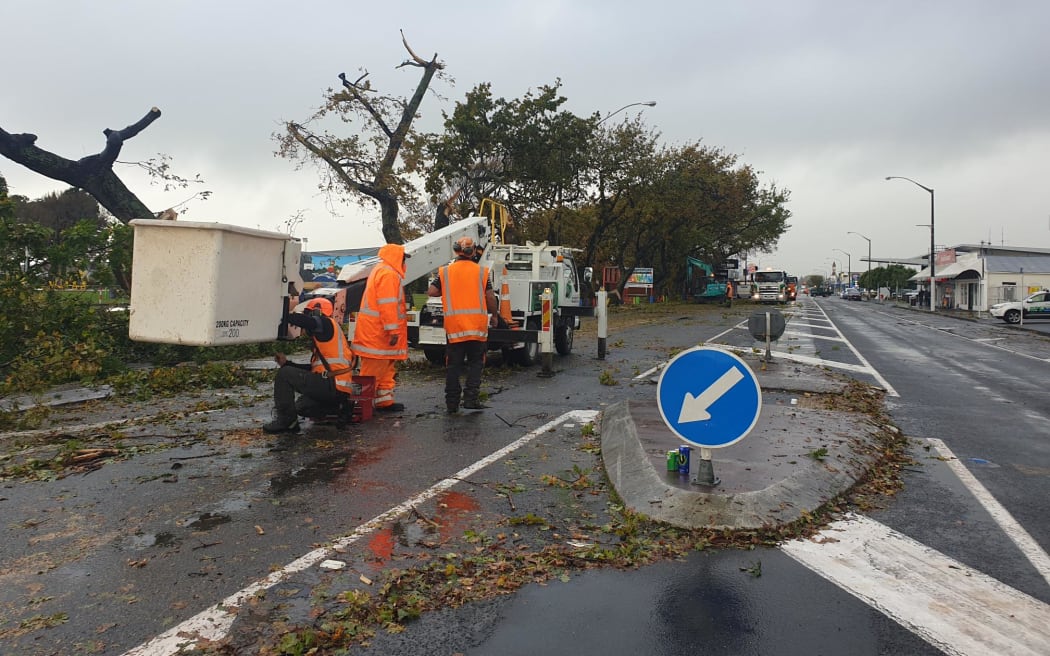 Crews clean up some of the damage caused by what locals are calling a 'mini tornado' in Levin on 20 May, 2022.