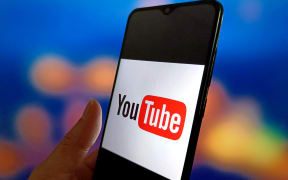 An illustration photo shows the YouTube logo displayed on a smartphone in Suqian, China, on March 6, 2025. (Photo Illustration by Costfoto/NurPhoto) (Photo by CFOTO / NurPhoto / NurPhoto via AFP)