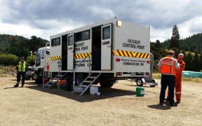 Richard McNamara and Rich Law, from the Blenheim rural fire force, in front of the incident control point.