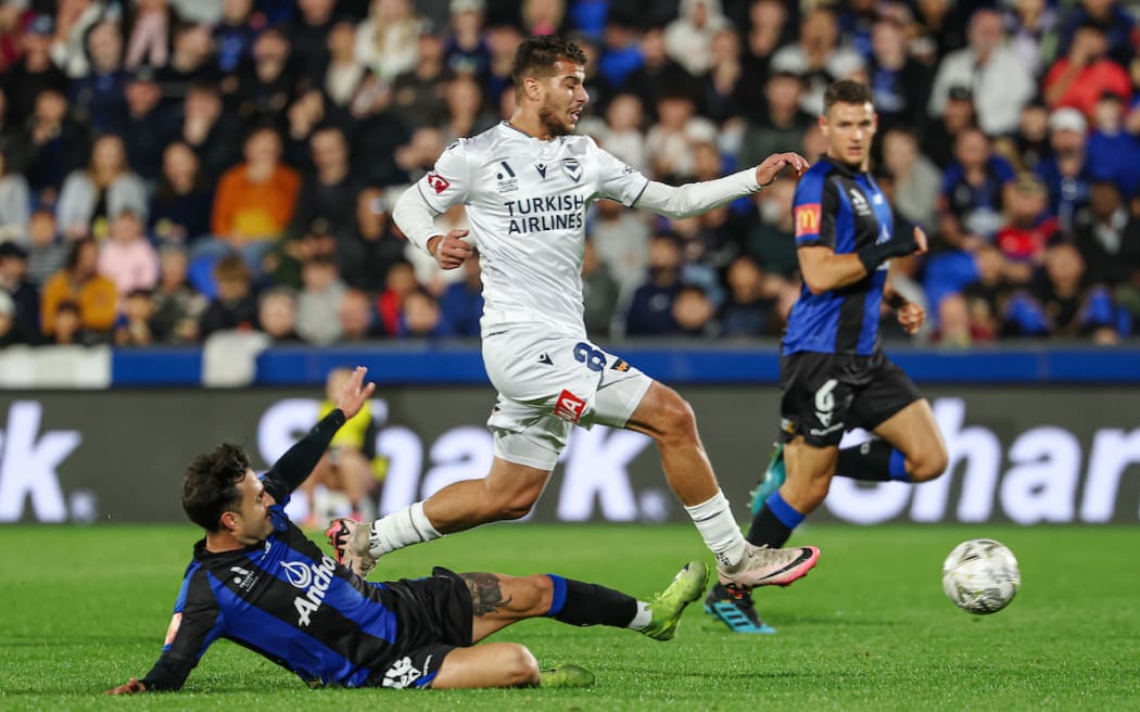 Melbourne Victory's Zinédine Machach and Auckland FC's Luis Leiva