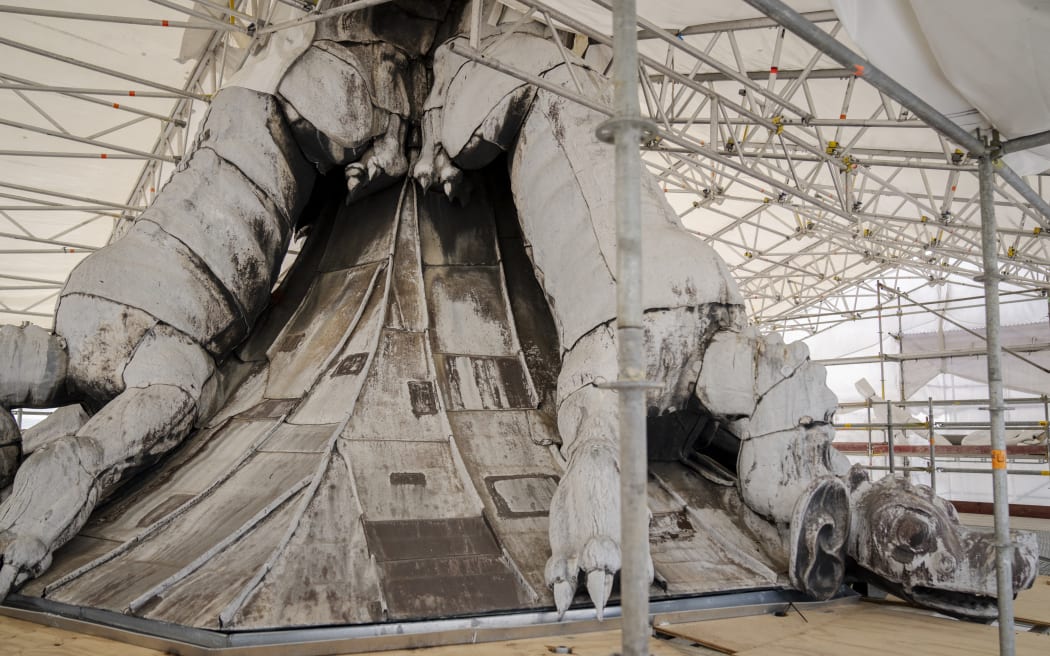 In this picture taken on April 15, 2024 shows the dragon spire on the roof of the Stock Exchange building, under renovation, in Copenhagen, Denmark. Danish rescue services said on April 16, 2024 that the fire that engulfed Copenhagen's 17th-century former stock exchange, ravaging the building and toppling its iconic spire, was "under control." Amid flames and black smoke, the 54-metre (180-foot) spire crashed into the street below the Borsen building on Tuesday morning, which had been undergoing renovation. (Photo by Ida Marie Odgaard / Ritzau Scanpix / AFP) / Denmark OUT