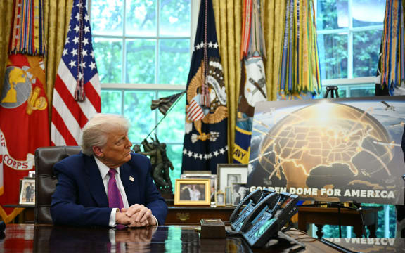 US President Donald Trump listens during the announcement about the Golden Dome missile defense shield, in the Oval Office of the White House in May.