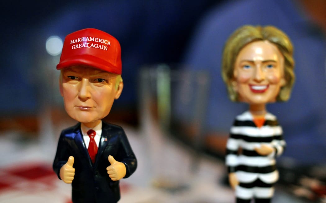 Bobble head figurines of Republican presidential nominee Donald Trump and Democratic presidential nominee Hillary Clinton greet Republican party supporters registering to watch the presidential debate.