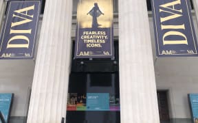 Outside the Auckland War Memorial Museum there are flags advertising the museum's newest exhibition DIVA