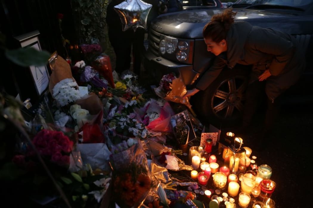 Flowers and messages outside the home of George Michael.