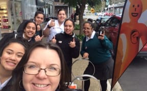 Teacher Jo Cameron and students after they voted.