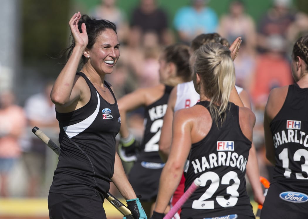 Black Sticks' Kayla Whitelock, left, and her team mates.