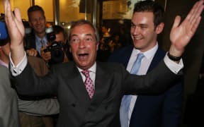 Leader of the United Kingdom Independence Party (UKIP), Nigel Farage reacts outside the Leave.EU referendum party at Millbank Tower in central London on June 24, 2016, as results indicate that it looks likely the UK will leave the European Union (EU).