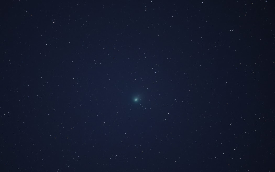 Comet C/2022 E3 (ZTF) is visible in the sky above the Mojave National Preserve in San Bernadino County as it approaches Earth for the first time in about 50,000 years on January 31, 2023 near Baker, California.