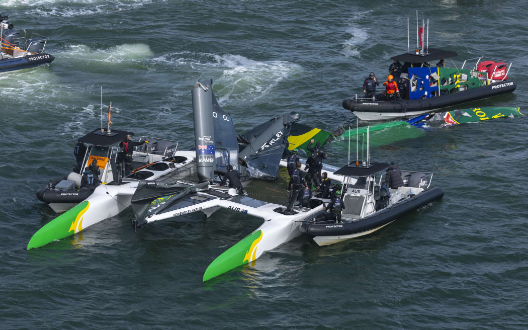 Australia SailGP Team helmed by Tom Slingsby are attended to by their support boat and the safety teams after the main wing broke during San Francisco Grand Prix, 2025.