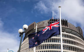 Flags at half mast in front of Parliament