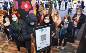 Shoppers queue to enter a department store in Melbourne, as the city further lifts Covid restrictions.