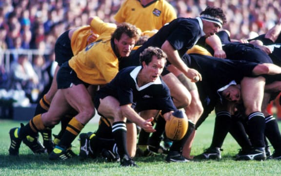 All Black halfback Bruce Deans clears the ball during a test against Australia at Eden Park in 1989.