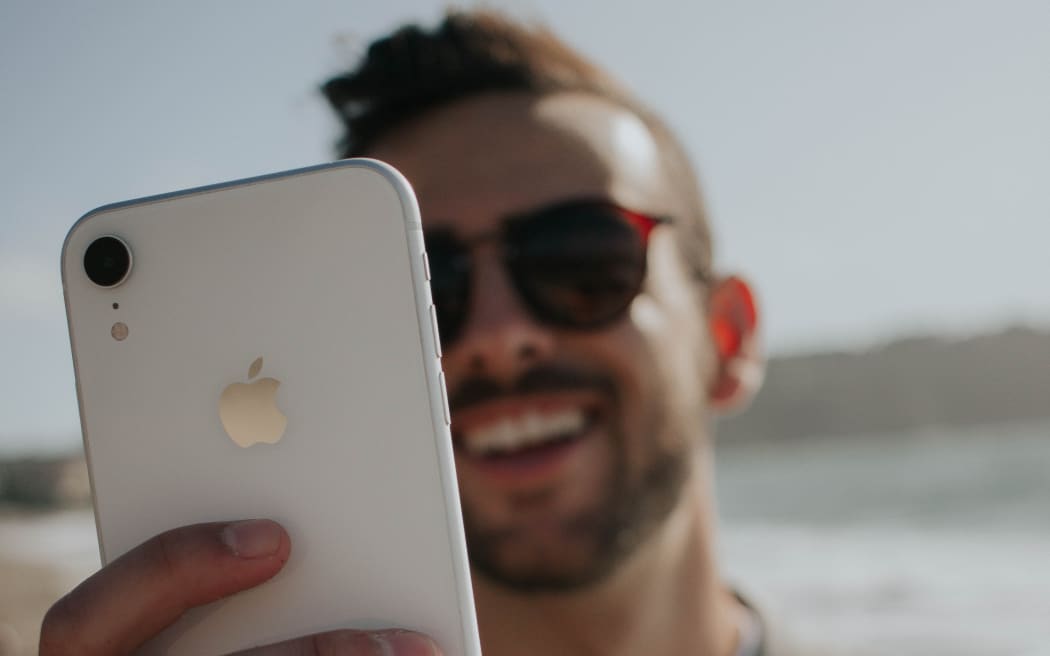 man holding iPhone