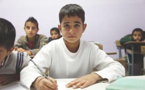An 11-year old refugee from Syria at school in Lebanon
