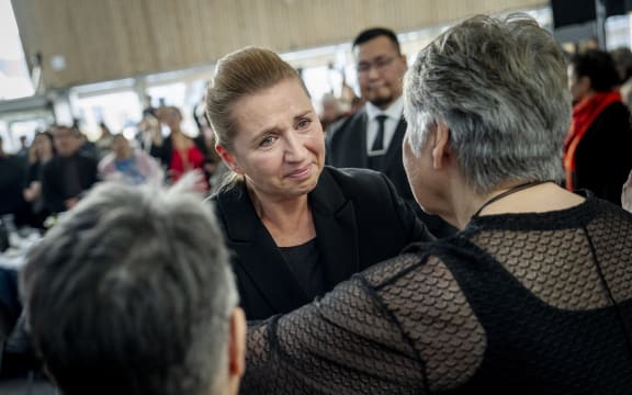 The chairman of the Naalakkersuisut Jens-Frederik Nielsen and Prime Minister Mette Frederiksen greet affected women in the spiral case after the official apology in the spiral case was given during an event at Katuaq in Nuuk, Greenland, on Wednesday, September 24, 2025. (Photo: Mads Claus Rasmussen/Ritzau Scanpix) (Photo by Mads Claus Rasmussen / Ritzau Scanpix via AFP)