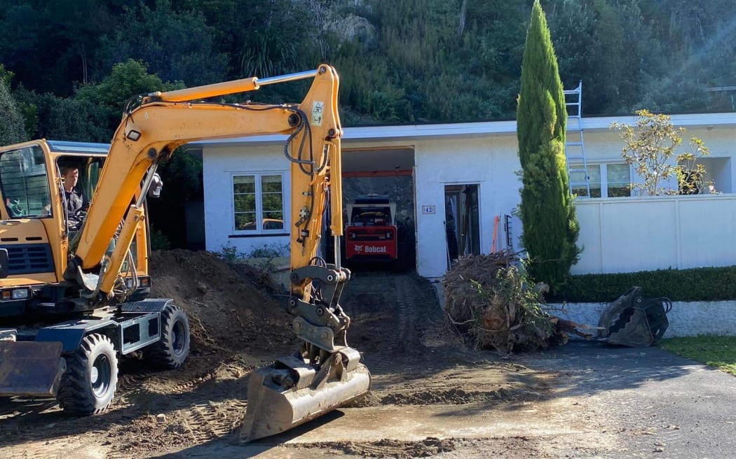 About 330 tonnes of dirt had to be removed from Jo and Murray's property in The Brook after the August 2022 storm.