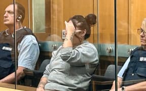 Sarangi Karamea Jaque-Oddell Lim, 28, hides her face in the High Court at Hamilton where she admitted a charge of attempted murder on Thursday.