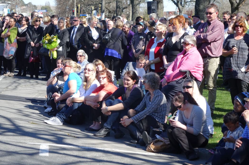 People gather for a memorial to the victims of Ashburton Work and Income shooting.