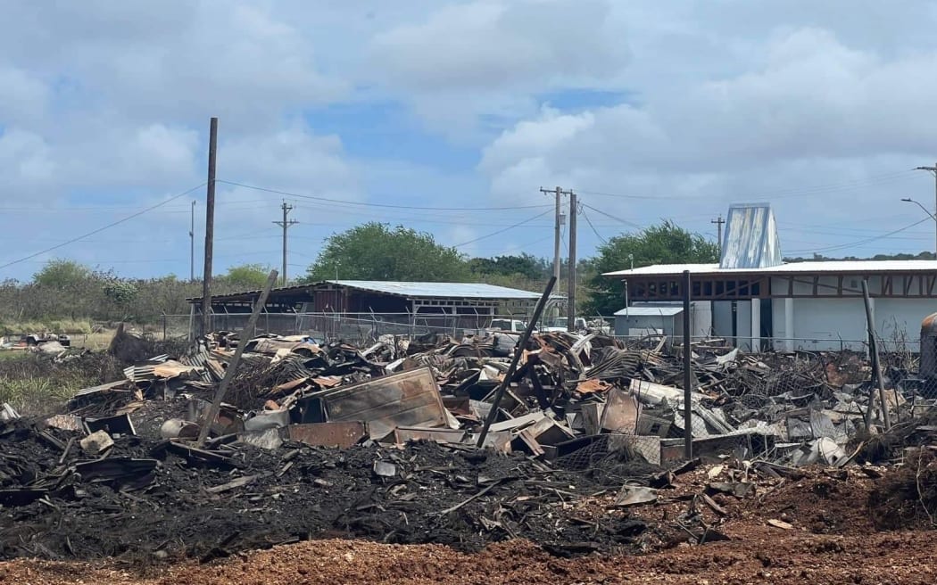 Waste and debris from Super Typhoon Yutu that was being sorted and stored for disposal on the Northern Marianas island of Tinian is seen charred and burnt after a grass fire swept through the area on 19 June, 2022.