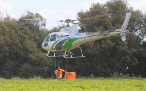 A helicopter crew fighting the Port Hills blaze.