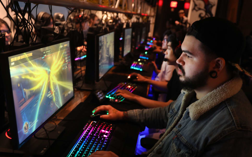 People play video games at the newly launched OS NYC, a fully equipped gaming lounge on September 19, 2019 in New York City. Re downloaded on 9 March 2020.