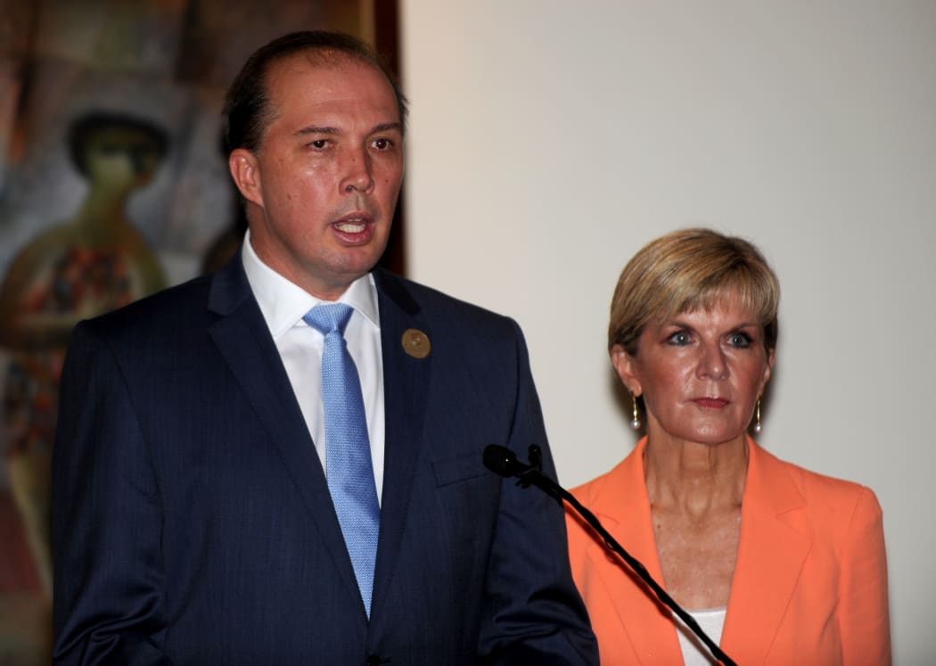 Australian Immigration Minister Peter Dutton (L) and Australian Foreign Minister Julie Bishop address journalists during a press conference in Nusa Dua, Bali on March 23, 2016.