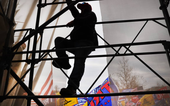 WASHINGTON, DC - JANUARY 06: Thousands of Donald Trump supporters storm the United States Capitol building following a "Stop the Steal" rally on January 06, 2021 in Washington, DC.