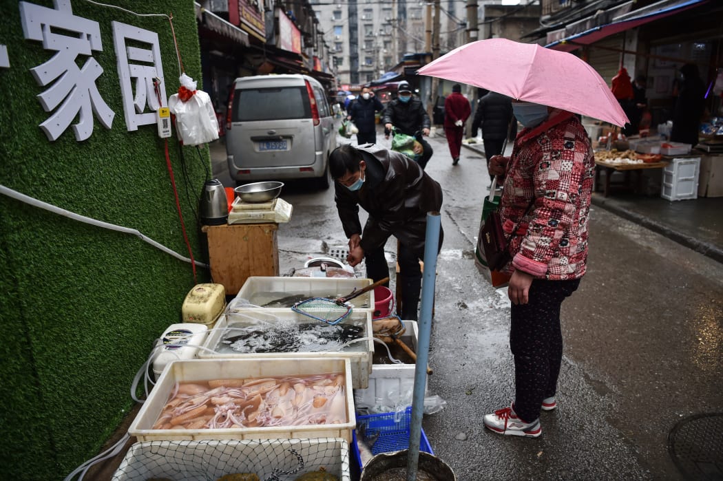 A vendor selling fish and turtles at a market in Wuhan where the coronavirus was first traced. On 24 January 2020.
