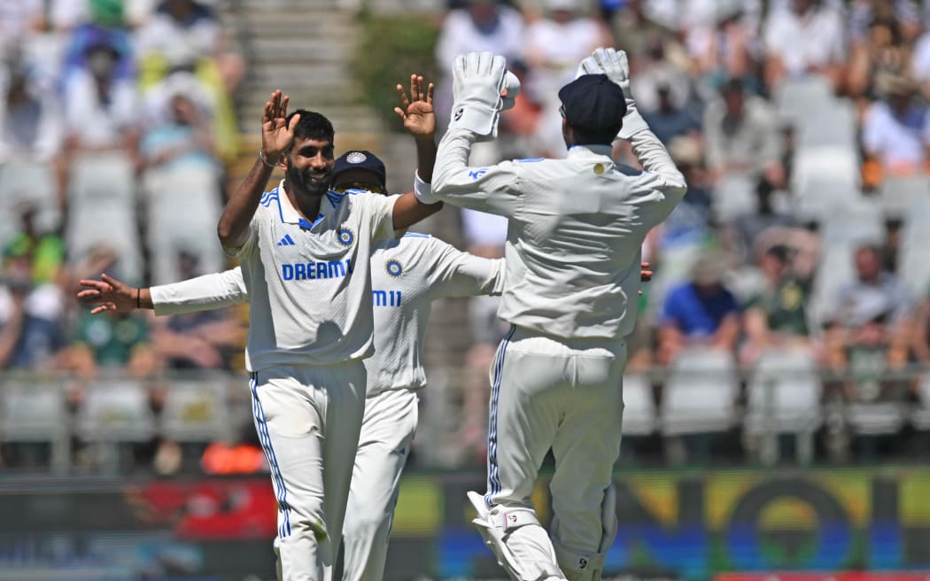 Jasprit Bumrah of India celebrates a wicket.