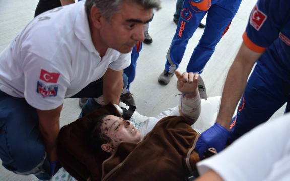 A Palestinian girl injured during the Israeli bombing of Gaza arrives in Turkey.